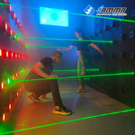 MetaNexusXR laser maze game kit fills a misty room with crisscrossing red beams, creating an immersive experience. | MetaNexusXR
